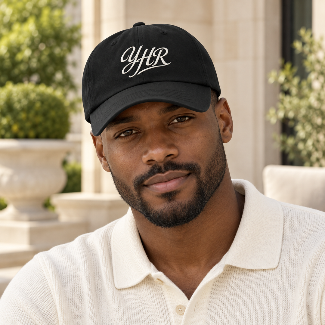 AI-generated lifestyle styling image of YHR Script Classic Dad Hat – Dark.