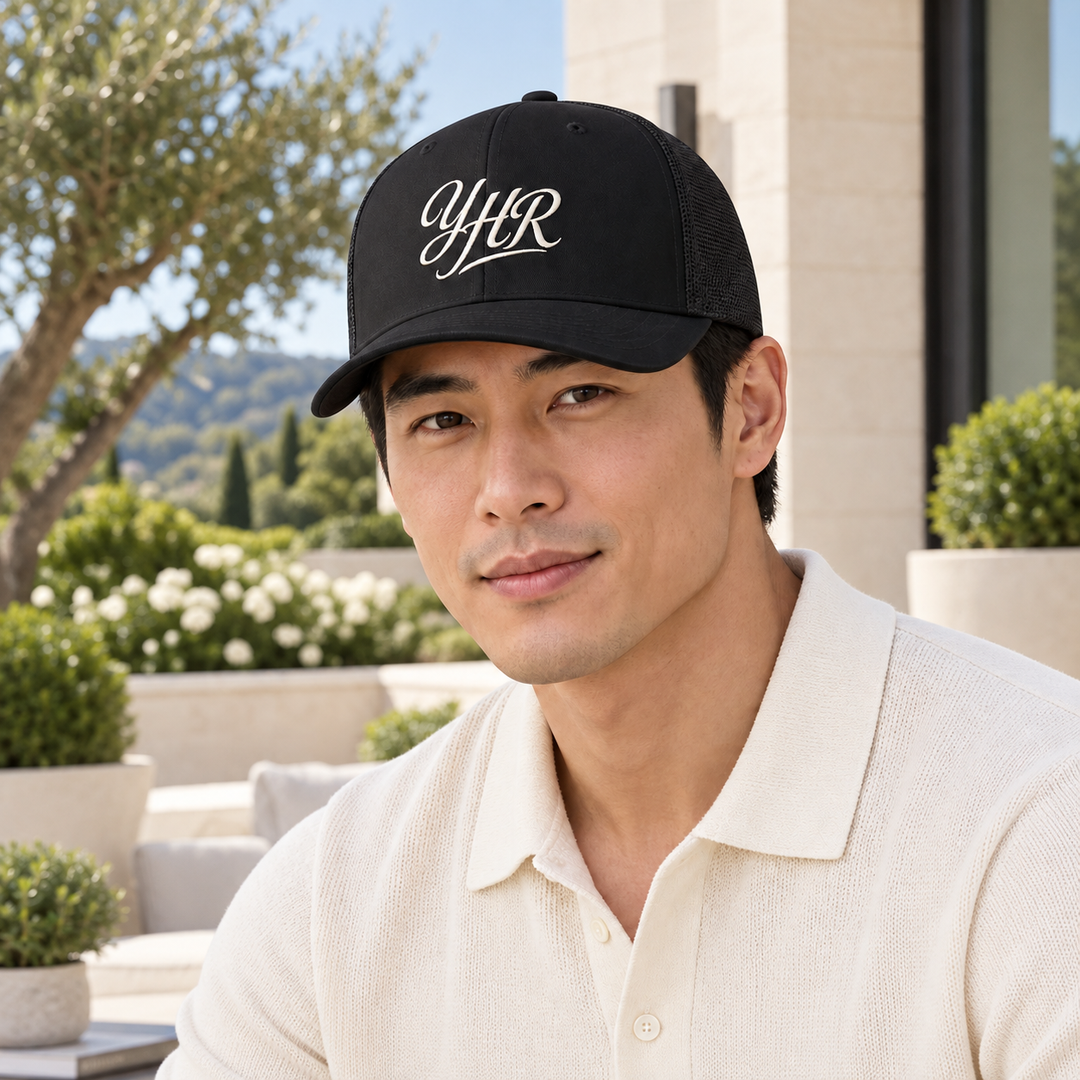 AI-generated lifestyle styling image of YHR Script Closed-Back Trucker Cap.