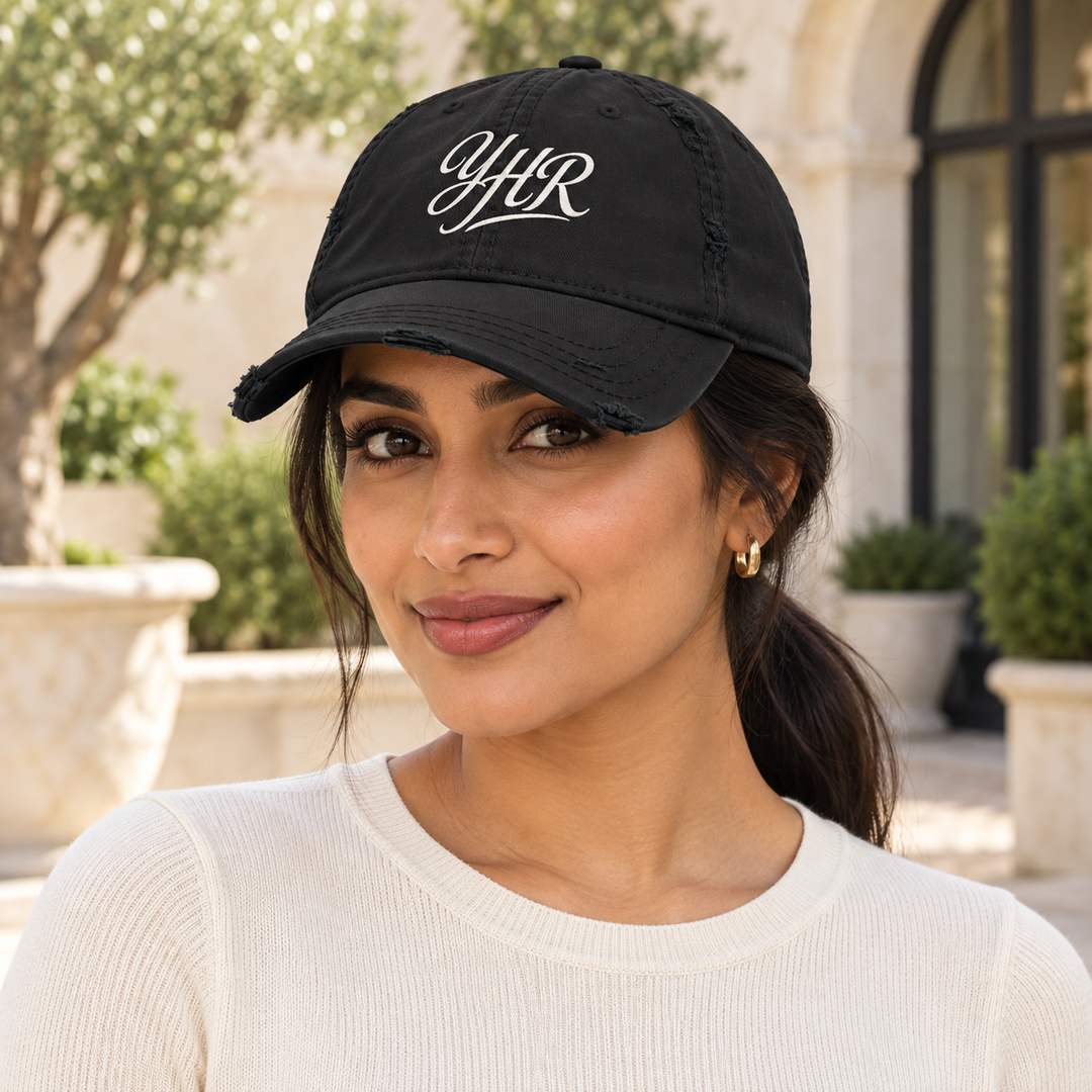 AI-generated lifestyle styling image of YHR Script Distressed Dad Hat – Black/Navy.