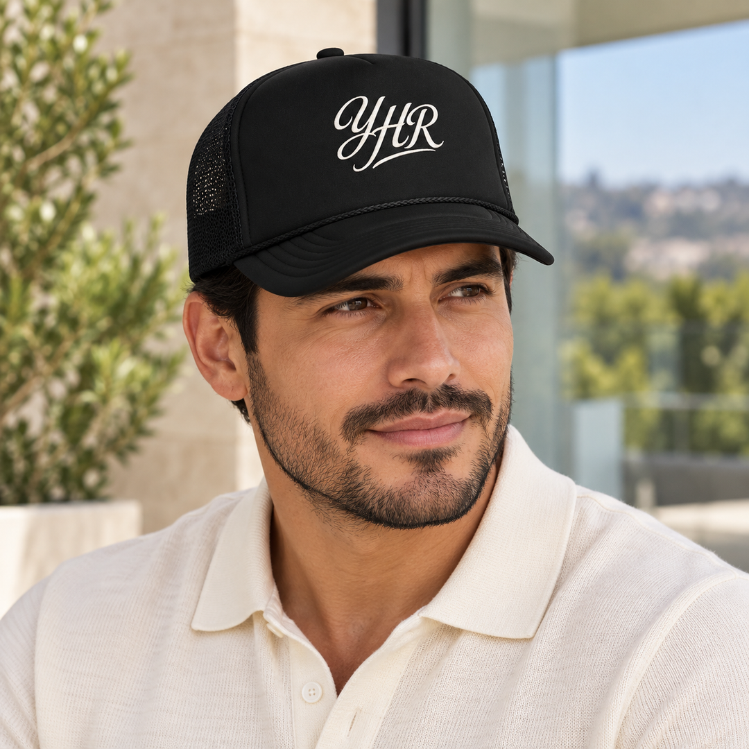 AI-generated lifestyle styling image of YHR Script Foam Trucker Hat.