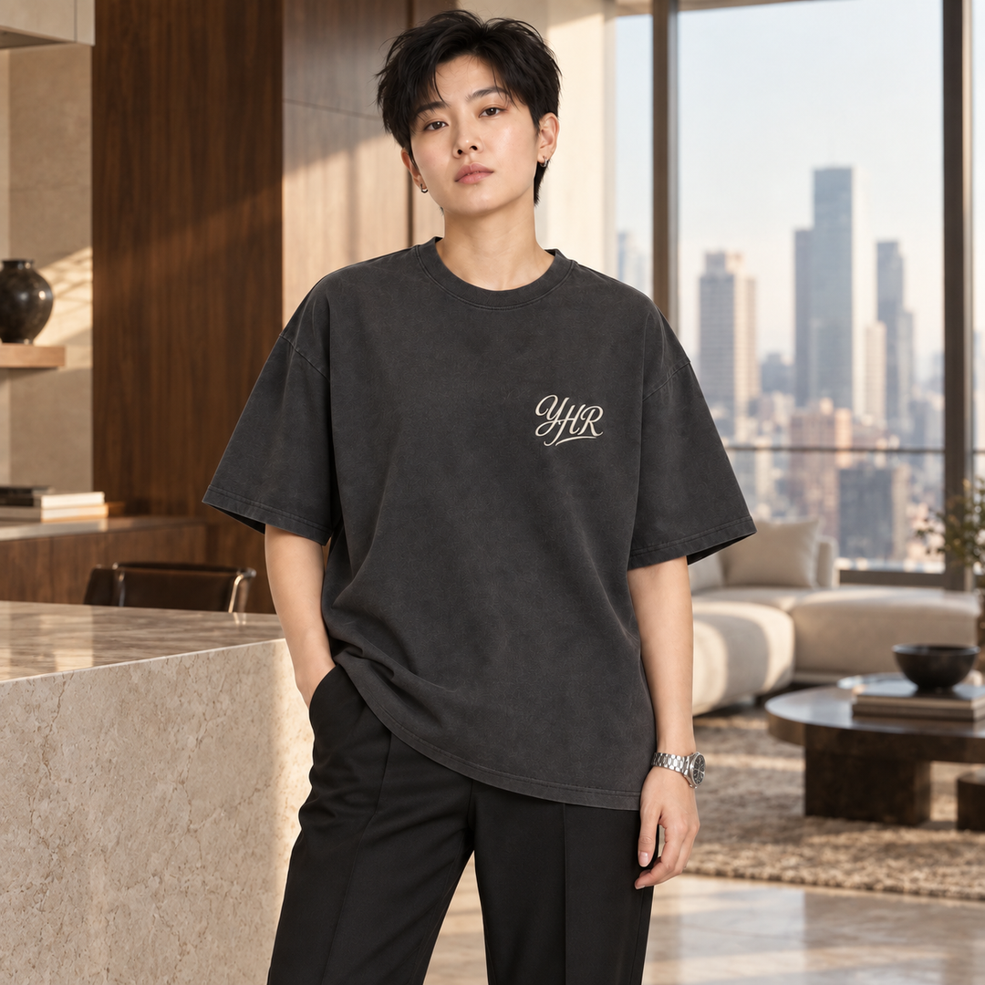 AI-generated lifestyle styling image of YHR Script Oversized Faded T-Shirt – Dark in an upscale setting.