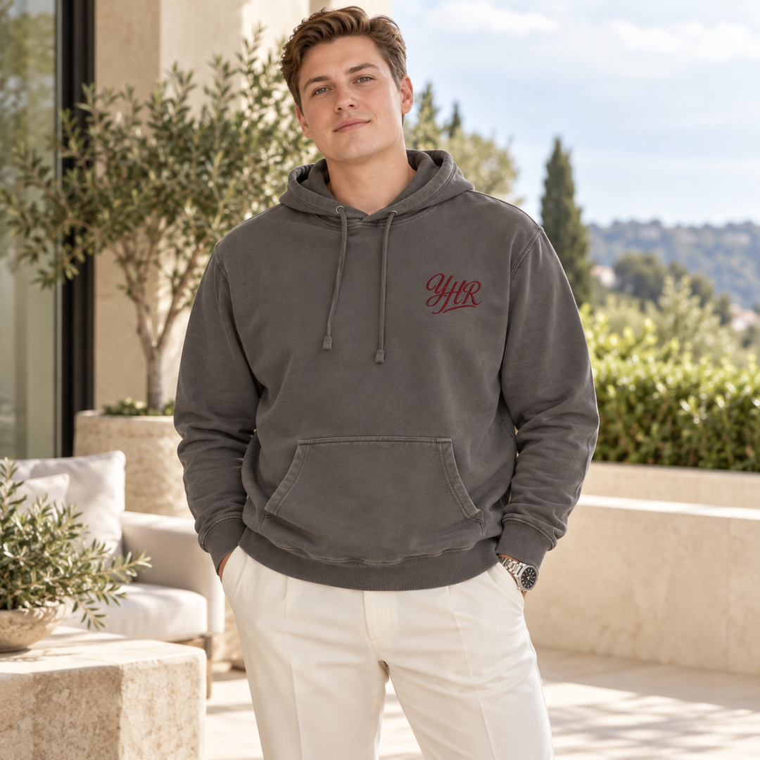 AI-generated lifestyle styling image of YHR Script Pigment-Dyed Hoodie.