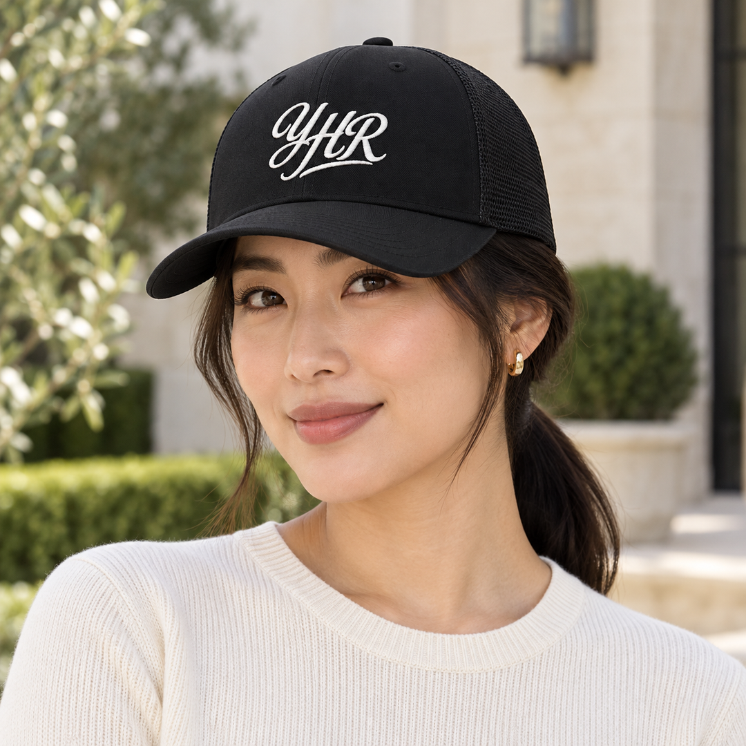 AI-generated lifestyle styling image of YHR Script Retro Trucker Cap.