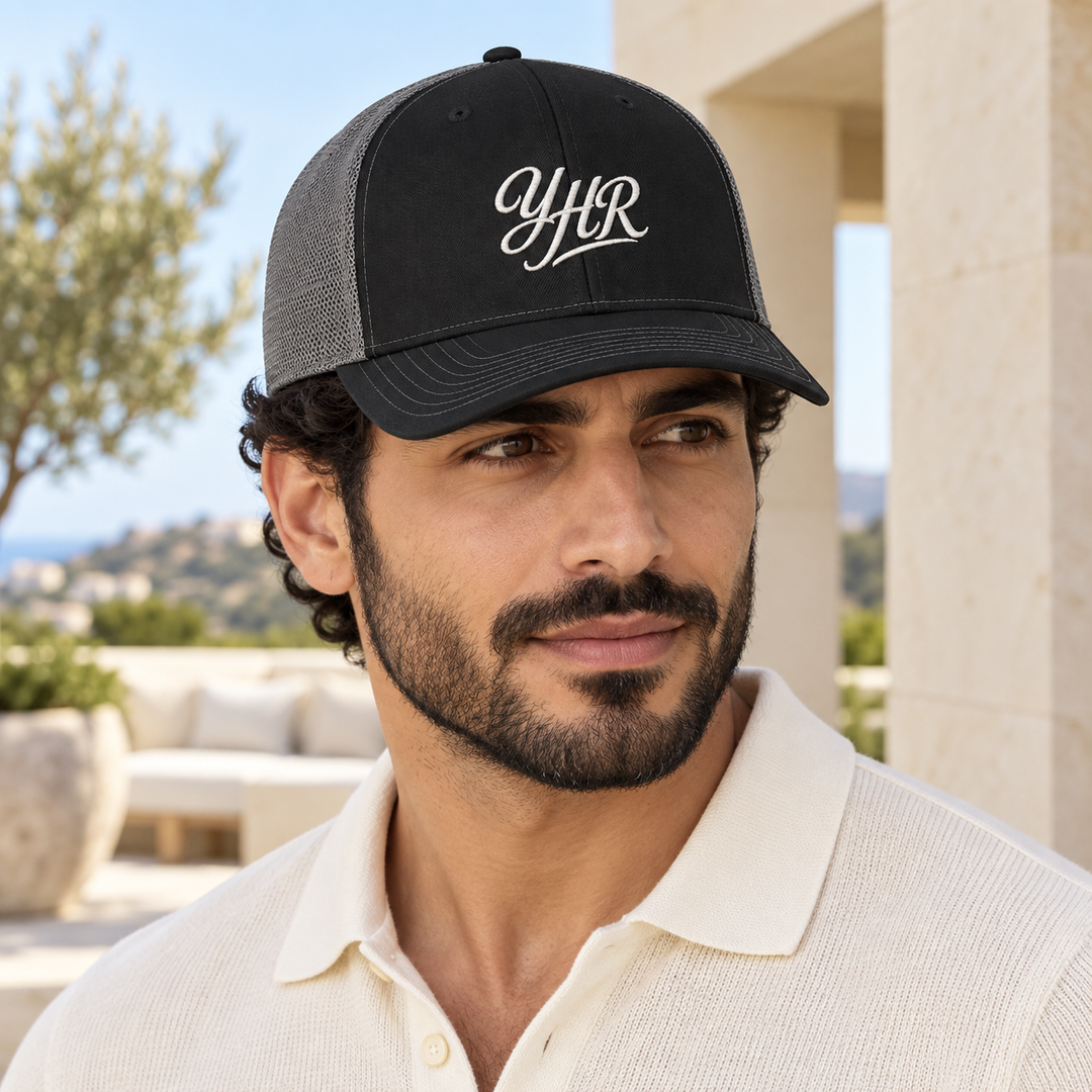 AI-generated lifestyle styling image of YHR Script Snapback Trucker Cap.