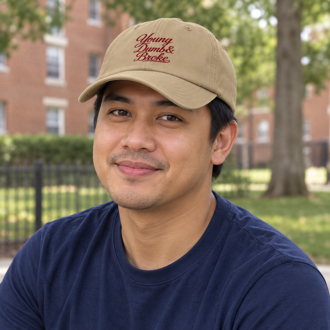 AI-generated lifestyle styling image of Young Dumb & Broke Classic Dad Hat – Light.