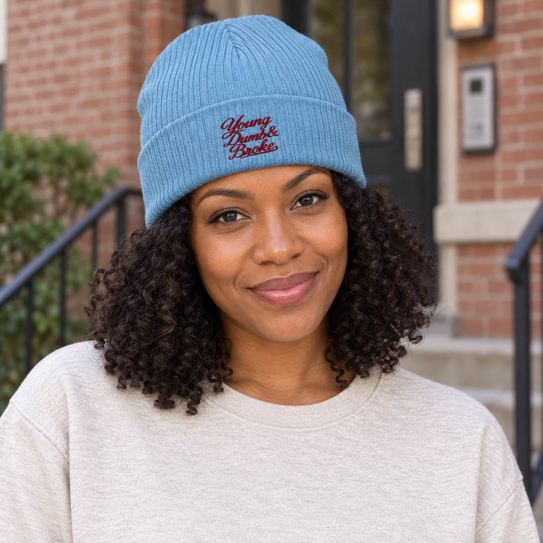 AI-generated lifestyle styling image of Young Dumb & Broke Organic Ribbed Beanie.