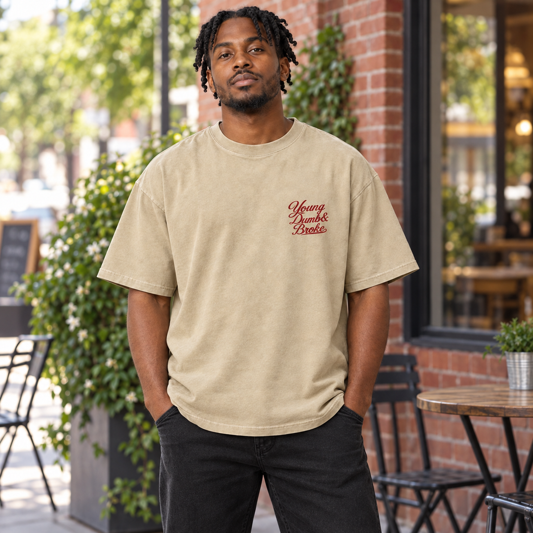 AI-generated lifestyle styling image of Young Dumb & Broke Oversized Faded T-Shirt – Light in an everyday neighborhood setting.
