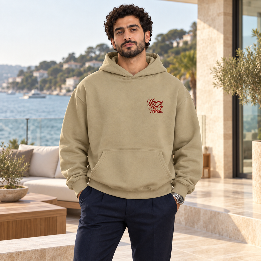 AI-generated lifestyle styling image of Young Hot & Rich Oversized Hoodie – Light in an upscale setting.